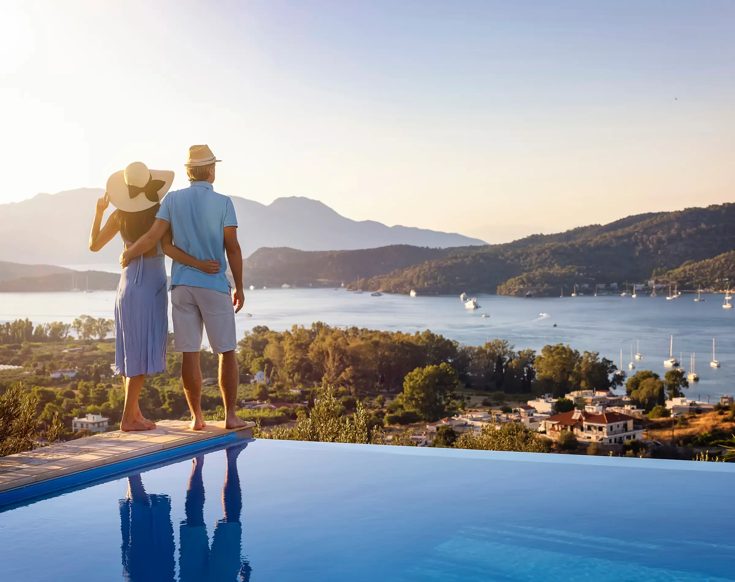 Couple by pool watching the view copy