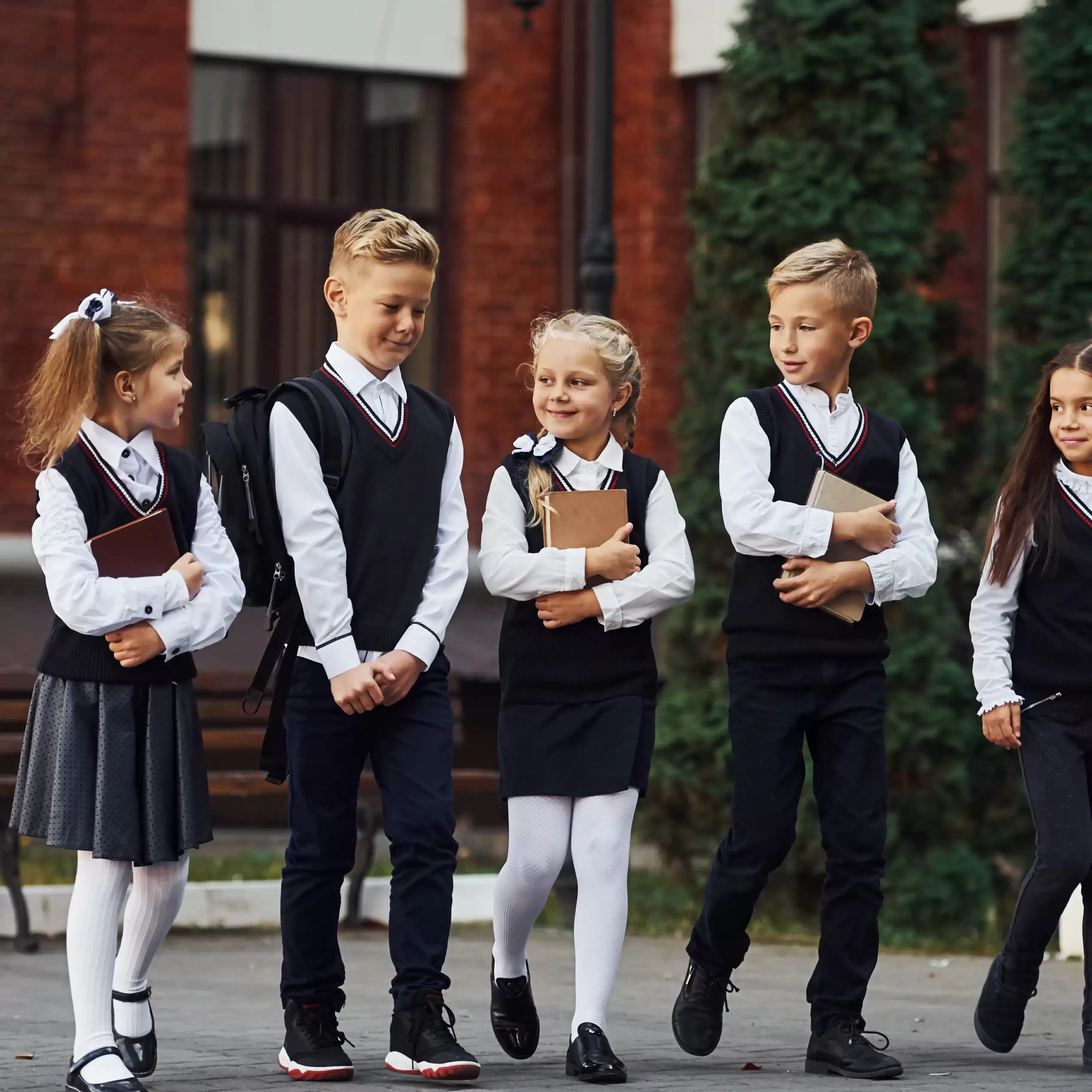 Children in school uniform walking together