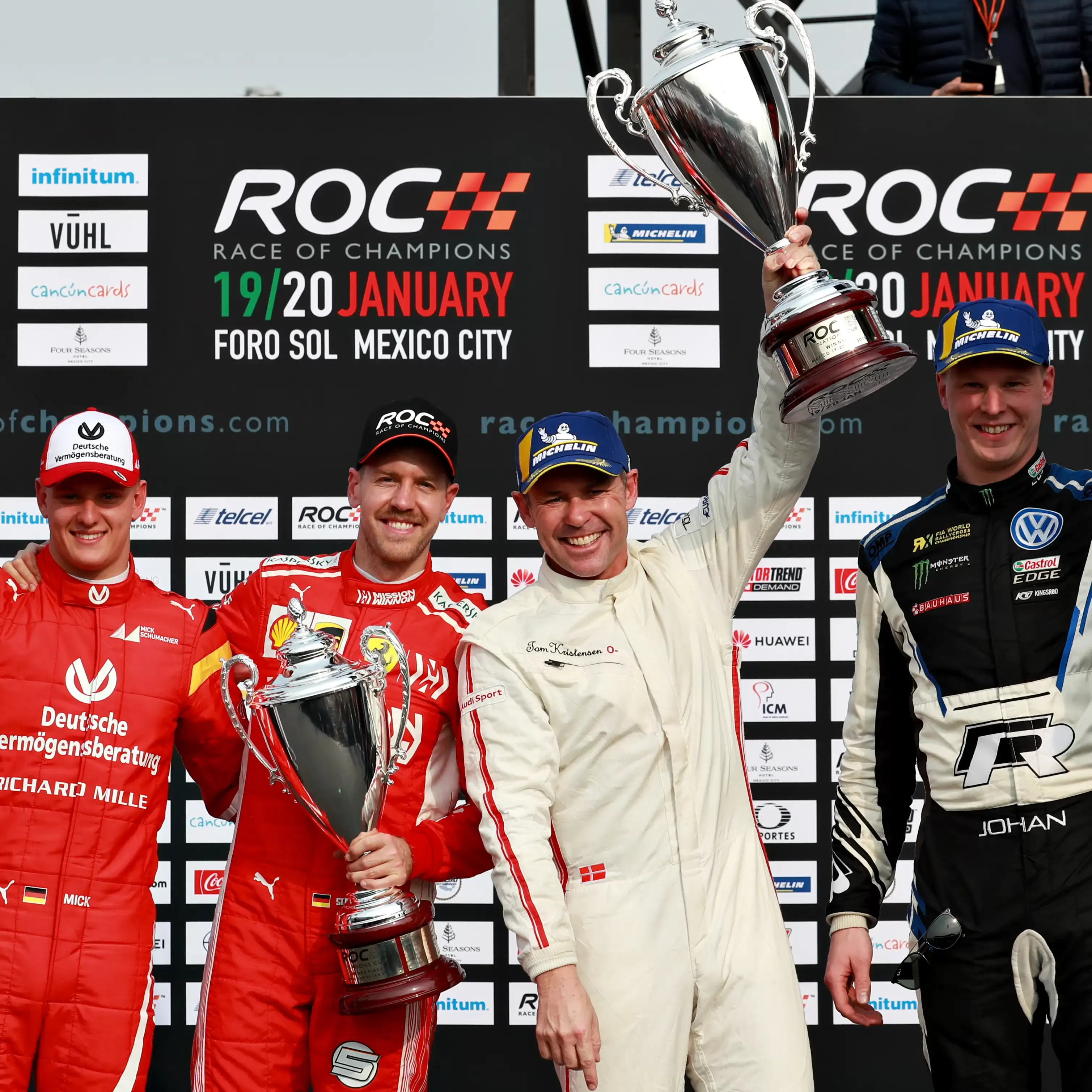 Champions celebrating with trophies at Motorsports Roc Snow and Ice race