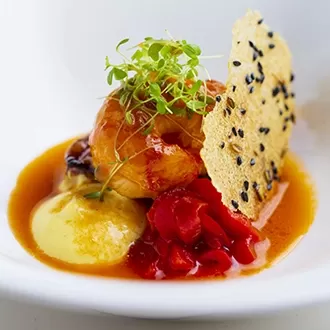 Plate of fine dining cuisine made by chef Raymond Blanc