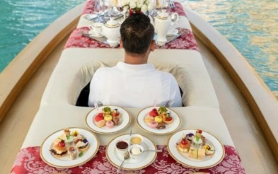 Afternoon tea served on a boat, on an Abra Dubai