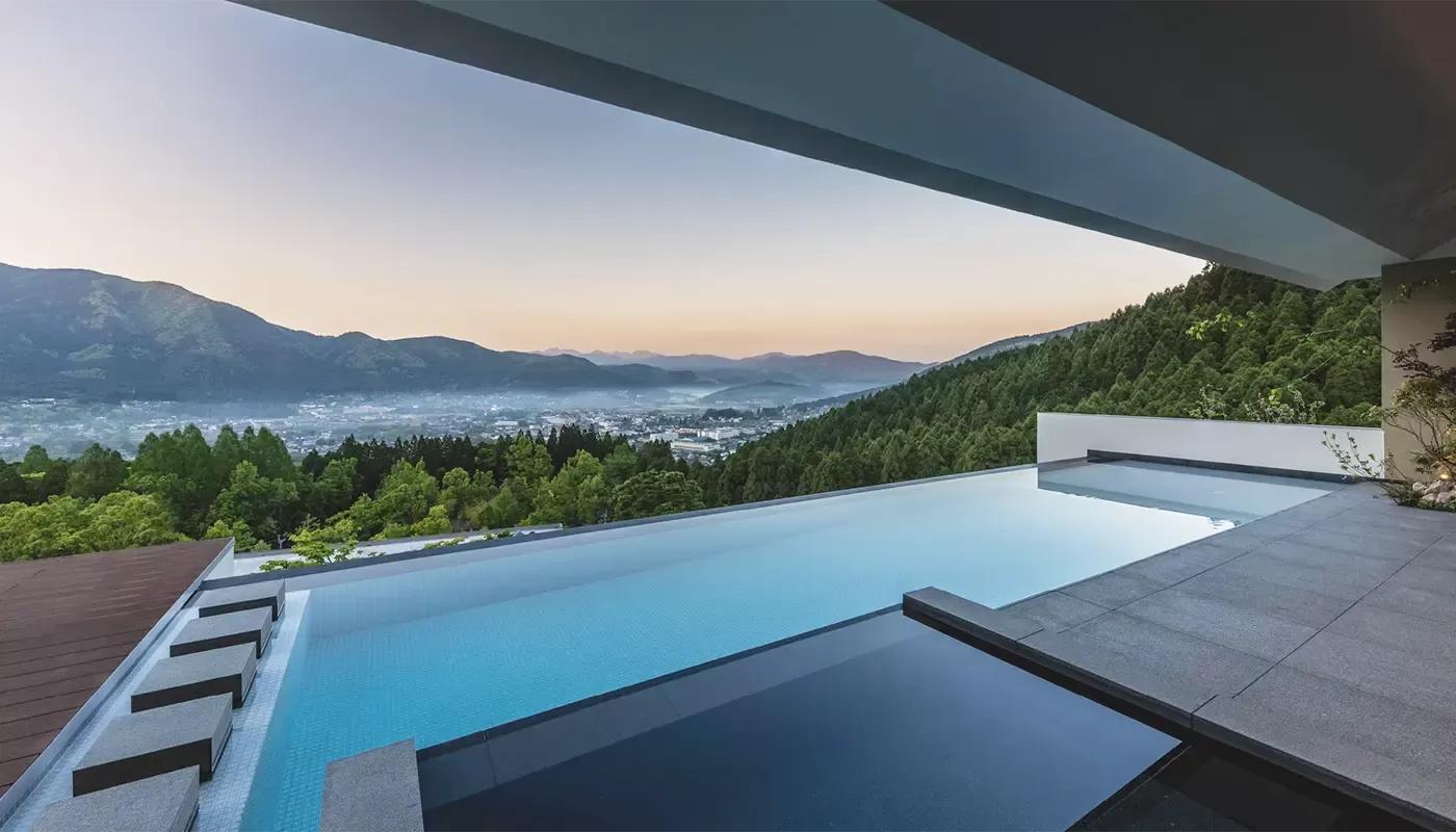 Hillside luxury resort pool with view at Enowa in Yufuin, Japan