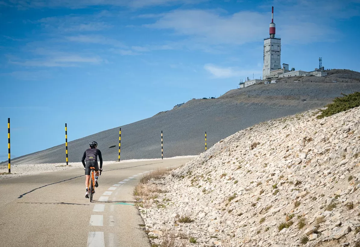 Cyclist cycling through the climbs and the vines of The Ventoux, Provence, France