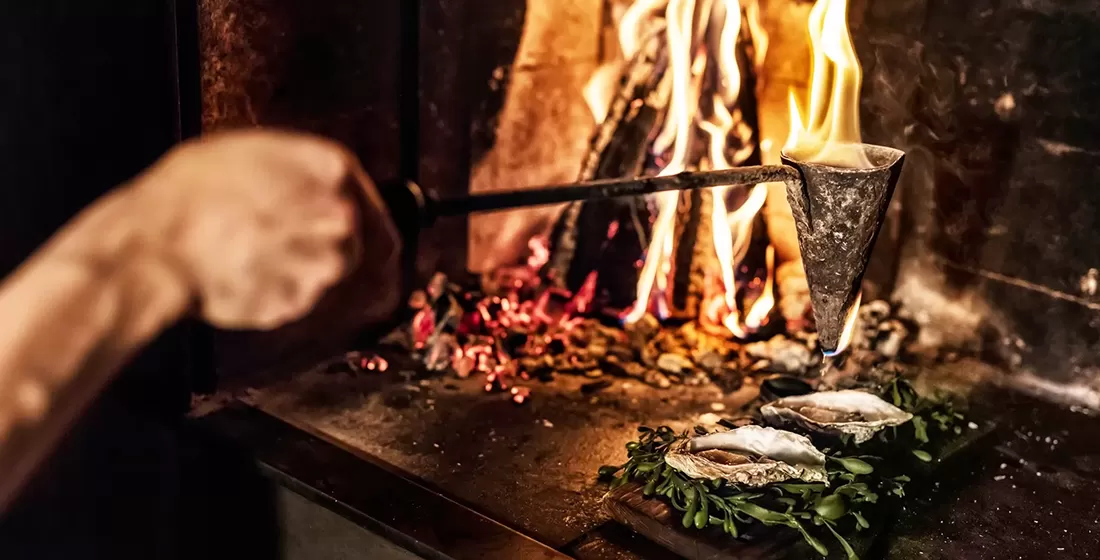 Fine dining cuisine cooked over open fire