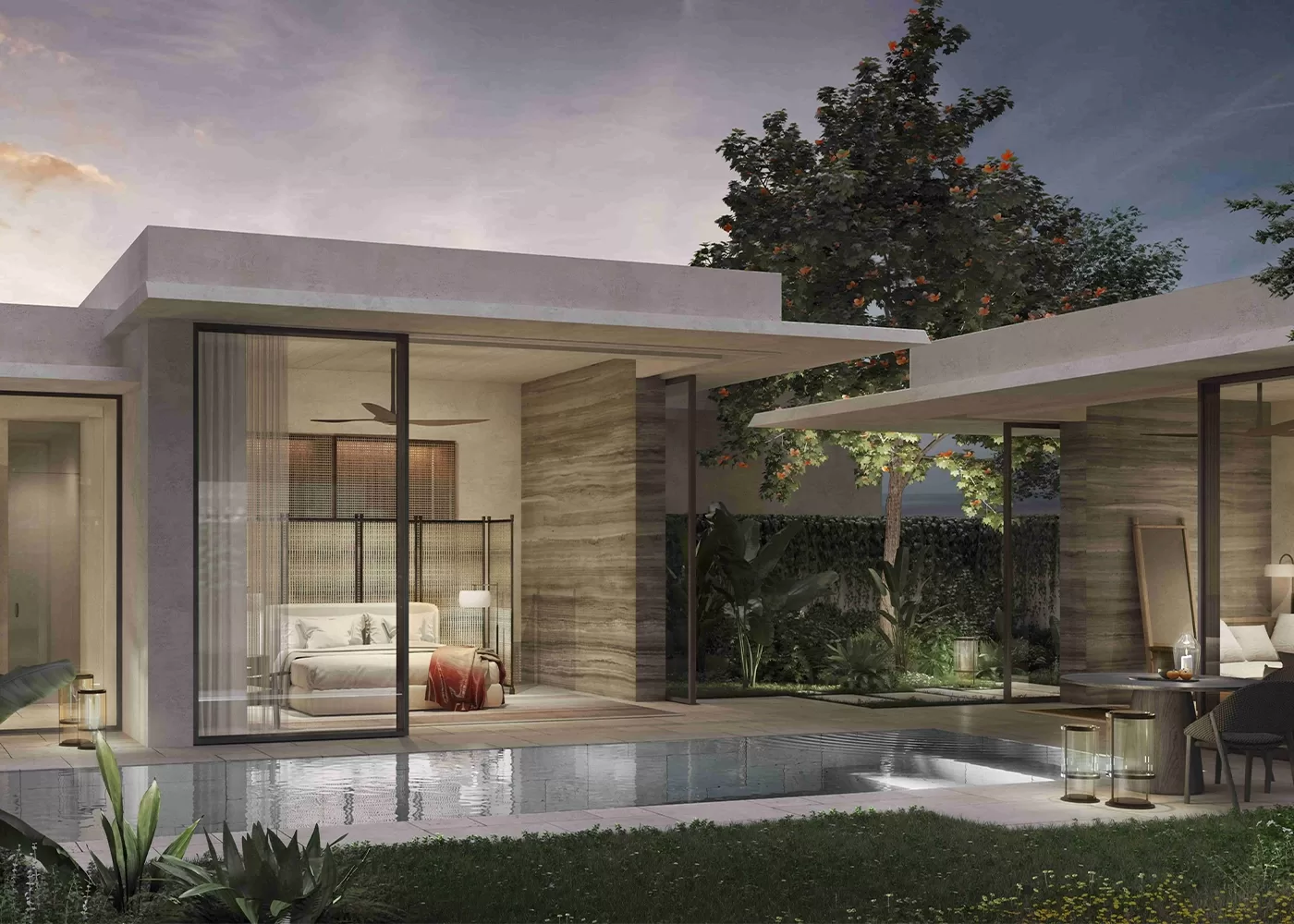 Modern villa with large glass windows overlooking a small pool. The interior bedroom is visible with a cosy bed and nightstand. Outdoor seating is arranged near the pool, surrounded by greenery. The sky shows a hint of sunset at Raffles Sentosa Singapore.