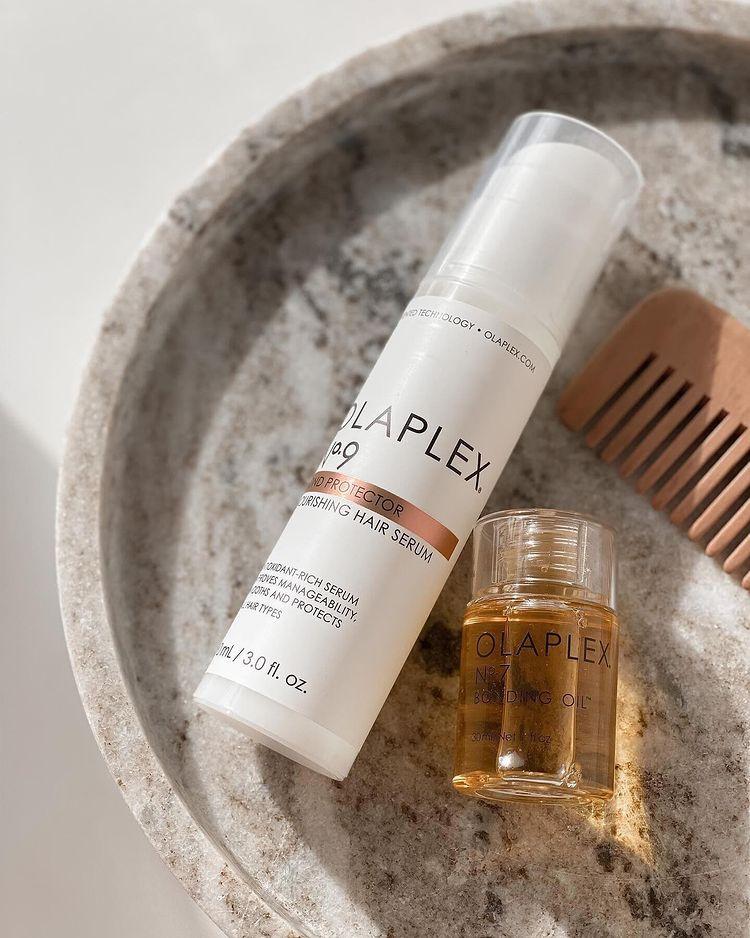 Olaplex bottles in a marble sink
