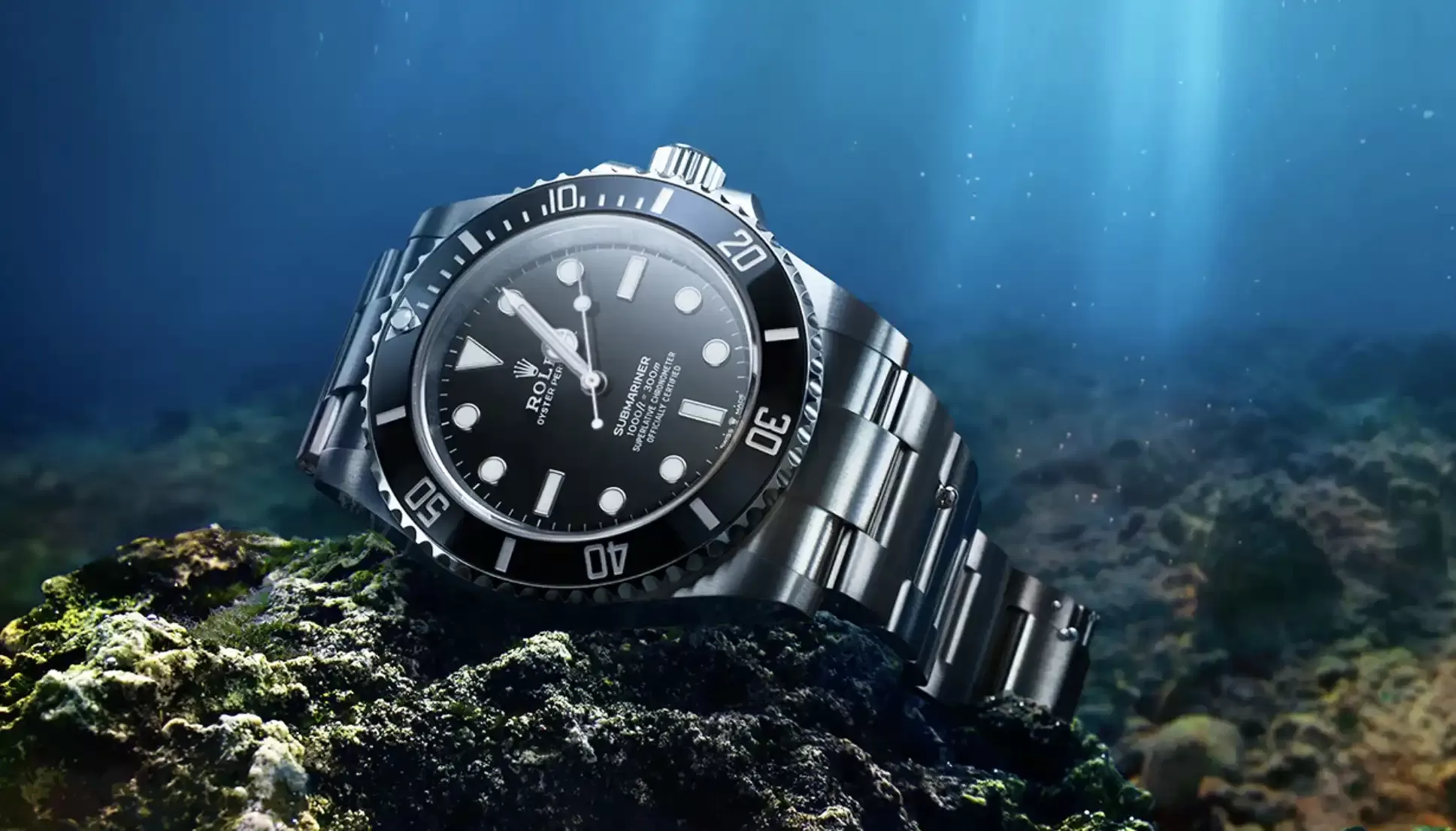 Rolex Submariner watch: Oystersteel - M124060-0001 sat in the bottom of sea on rocks