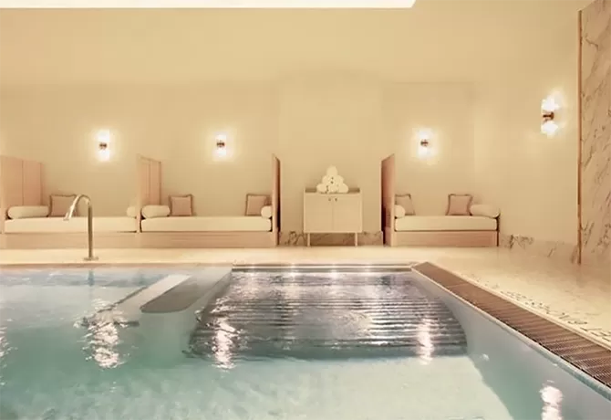 Luxury indoor spa pool with water fountain and spray jets at 3. Spa Diane Barrière, New York