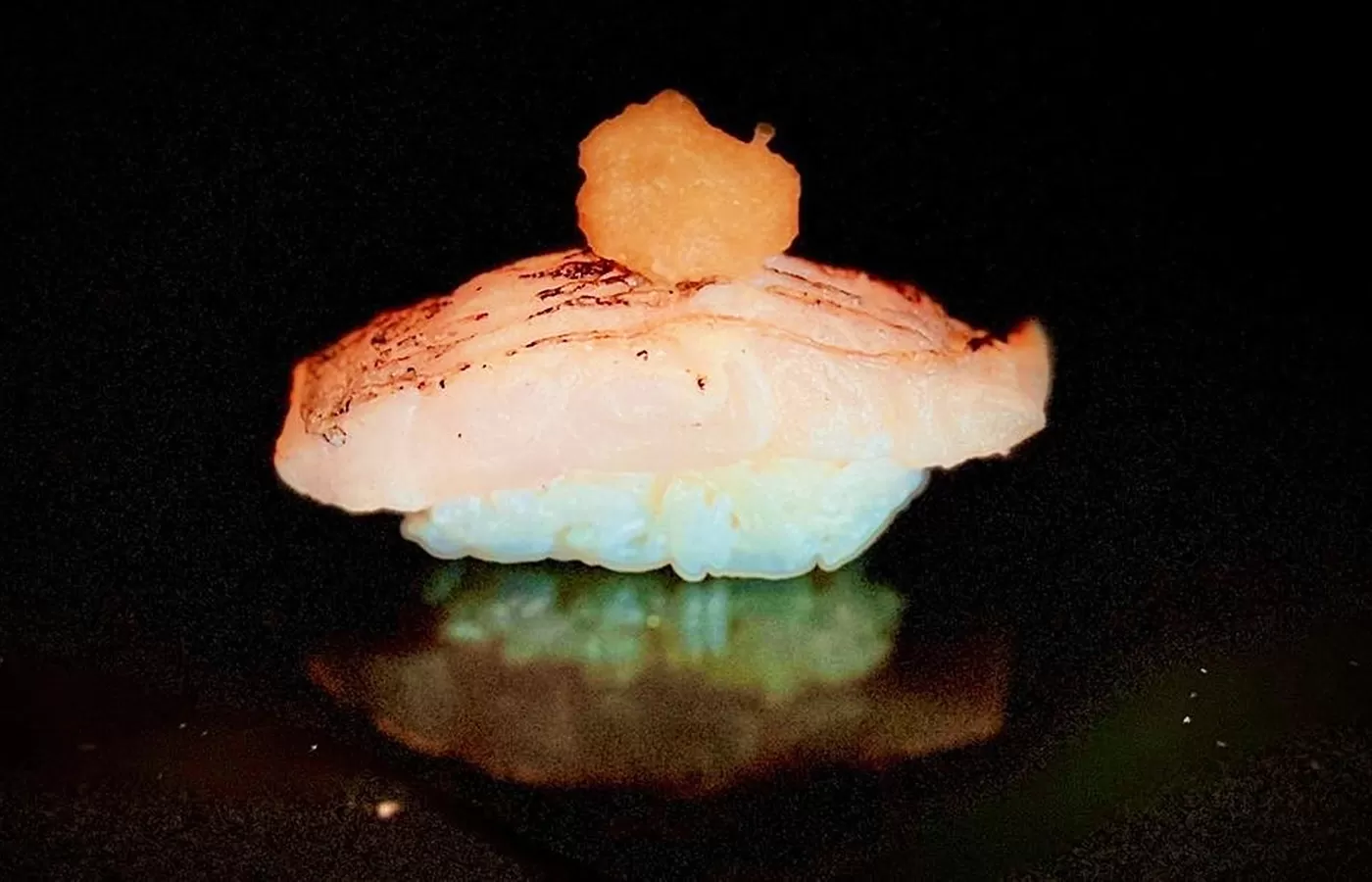 Rice sushi with salmon on top